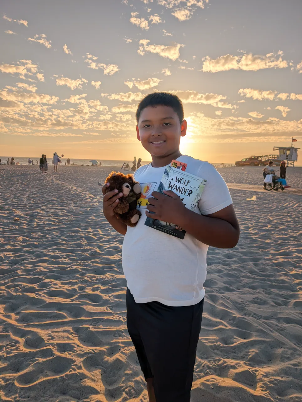 Ray holding Mr. Bearry on Venice Beach in the evening light