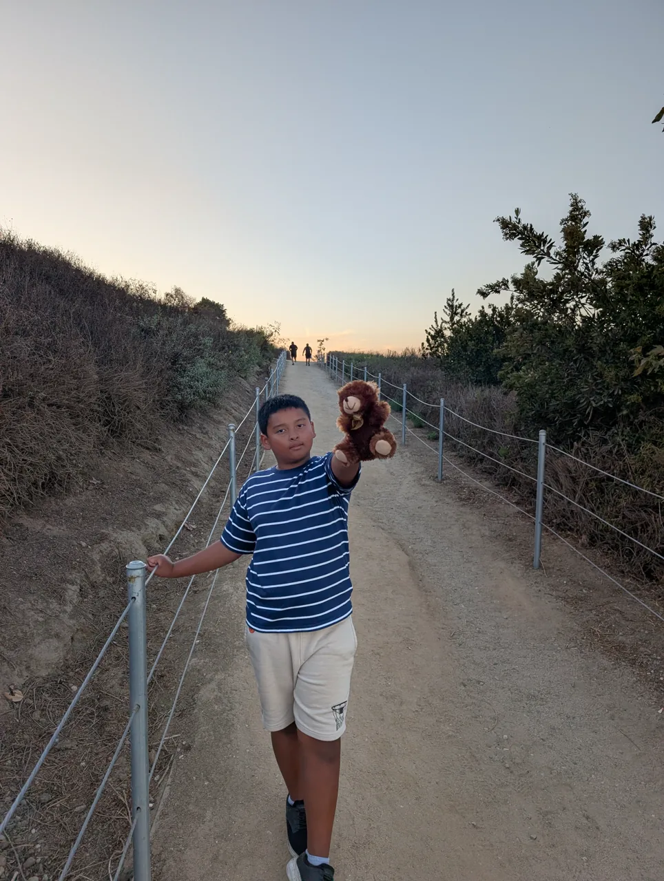 Ray carrying Mr. Bearry while climbing the Baldwin Hills steps